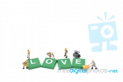 Miniature Worker Team Building Word Love On White Background Stock Photo