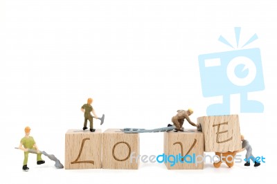 Miniature Worker Team Building Word Love On White Background Stock Photo