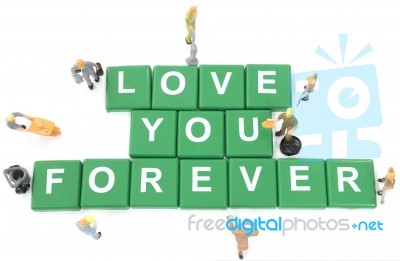 Miniature Worker Team Building Word Love You Forever On White Ba… Stock Photo