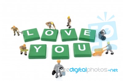 Miniature Worker Team Building Word Love You On White Background… Stock Photo