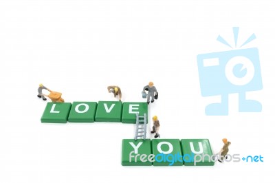 Miniature Worker Team Building Word Love You On White Background… Stock Photo