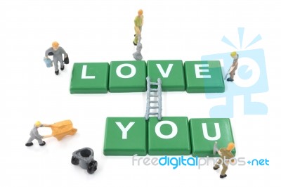 Miniature Worker Team Building Word Love You On White Background… Stock Photo