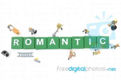 Miniature Worker Team Building Word Romantic On White Background… Stock Photo