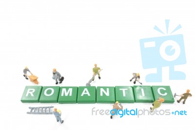 Miniature Worker Team Building Word Romantic On White Background… Stock Photo