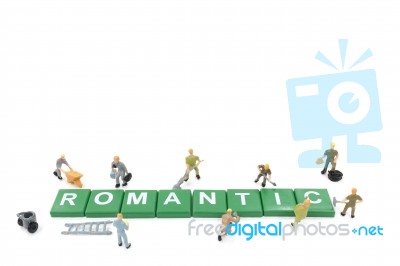 Miniature Worker Team Building Word Romantic On White Background… Stock Photo