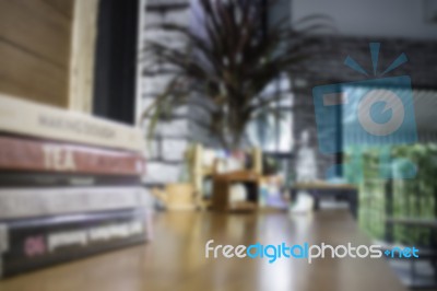 Minimal Green Plant In Pot On Table Stock Photo