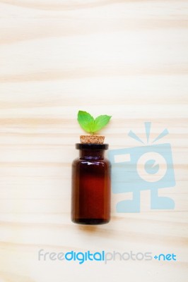 Mint Essential Oil In A Glass Bottle Stock Photo