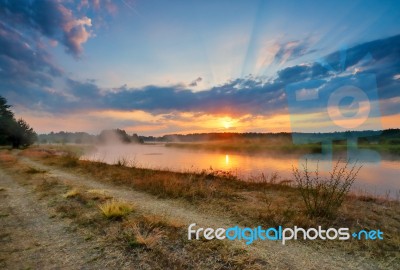 Misty Summer Sunrise. Foggy River In The Morning. Misty Morning Stock Photo