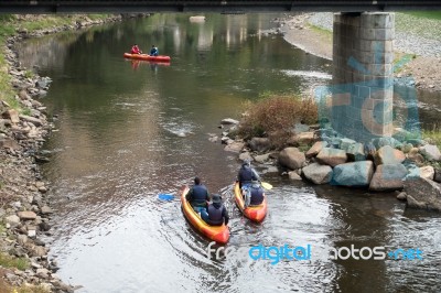 < Mixed People Canoeing Down The Vlatava River To Krumlov> Stock Photo