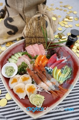 Mixed Sashimi On Red Ceramic Plate Stock Photo