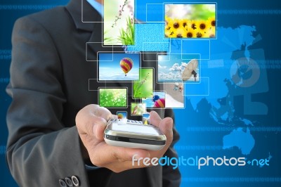 Mobile And Streaming Images On Hand Stock Photo