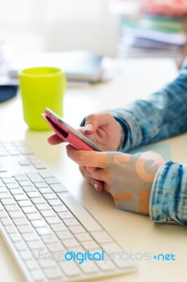 Mobile Phone In A Woman's Hand. Indoor Image Stock Photo