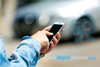 Mobile Phone In A Woman's Hand. Outdoor Image Stock Photo