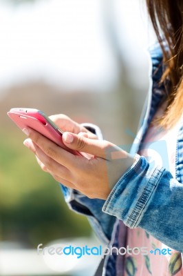 Mobile Phone In A Woman's Hand. Outdoor Image Stock Photo