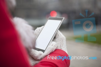 Mobile Phone In Hands With Glowes, Cold Weather Stock Photo