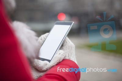 Mobile Phone In Hands With Glowes, Cold Weather Stock Photo