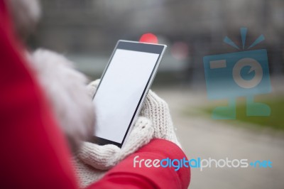 Mobile Phone In Hands With Glowes, Cold Weather Stock Photo