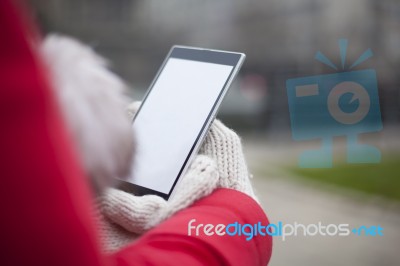 Mobile Phone In Hands With Glowes, Cold Weather Stock Photo