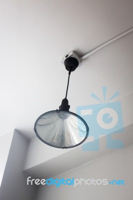 Modern Ceiling Lamp In White Room Stock Photo