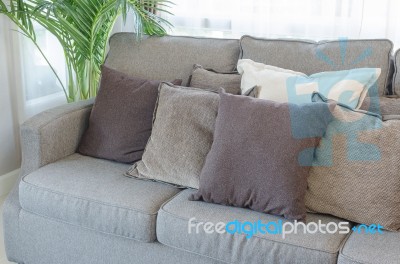 Modern Grey Sofa With Pillows Stock Photo