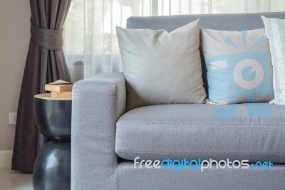 Modern Grey Sofa With Pillows In Living Room Stock Photo