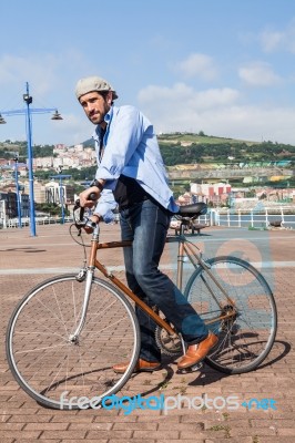 Modern Man Riding A Urban Bike Stock Photo