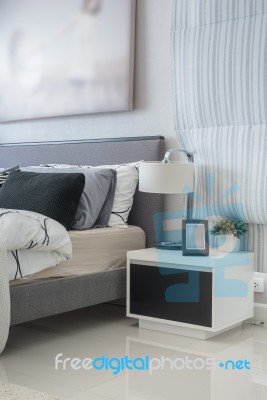 Modern White Lamp On White Table In Bedroom Stock Photo