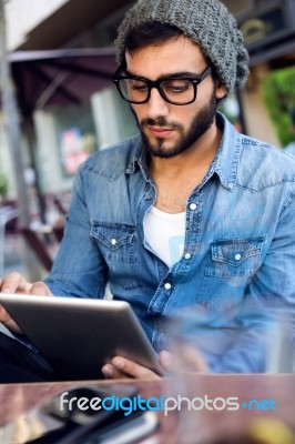 Modern Young Man With Digital Tablet In The Street Stock Photo