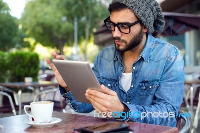 Modern Young Man With Digital Tablet In The Street Stock Photo