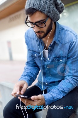 Modern Young Man With Mobile Phone In The Street Stock Photo