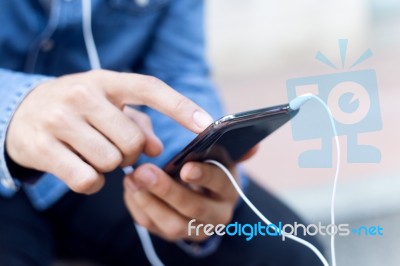 Modern Young Man With Mobile Phone In The Street Stock Photo