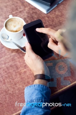 Modern Young Man With Mobile Phone In The Street Stock Photo