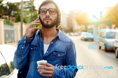 Modern Young Man With Mobile Phone In The Street Stock Photo