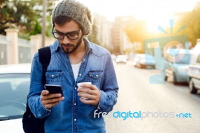 Modern Young Man With Mobile Phone In The Street Stock Photo