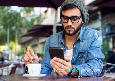 Modern Young Man With Mobile Phone In The Street Stock Photo