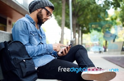 Modern Young Man With Mobile Phone In The Street Stock Photo