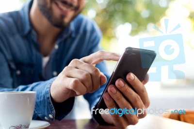 Modern Young Man With Mobile Phone In The Street Stock Photo