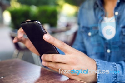 Modern Young Man With Mobile Phone In The Street Stock Photo