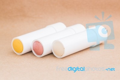 Moisturizer Lipstick On Brown Natural Background Stock Photo