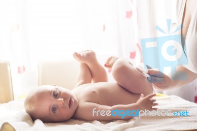 Mom Carefully Clean Baby Skin With Wet Wipes Stock Photo