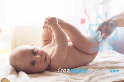 Mom Carefully Clean Baby Skin With Wet Wipes Stock Photo