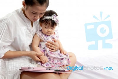 Mom Is Playing Tablet With Her Baby Stock Photo