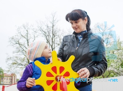 Mom Plays With Her Daughter On A Toy Ship Stock Photo