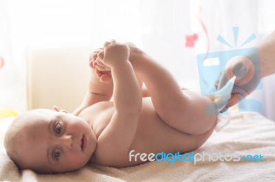 Momy Cleaning Baby Skin With Wet Wipes Stock Photo