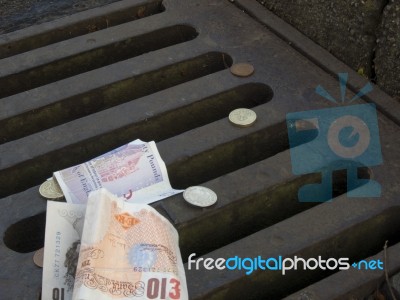 Money Down The Drain Stock Photo