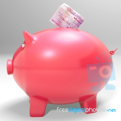 Money Entering Piggybank Shows Saving Incomes Stock Image