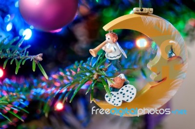 Moon And Angels On A Christmas Tree Stock Photo