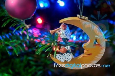 Moon And Angels On A Christmas Tree Stock Photo