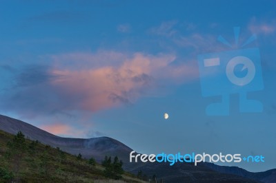 Moon Rising Over The Cairngorm Mountains Stock Photo