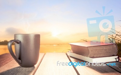 Morning Cup Of Coffee With River Background At Sunrise Stock Photo